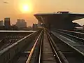 Sungai Buloh train approaching the station in the evening.