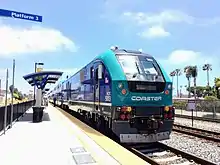 Left: A COASTER Bombardier BiLevel cab car at San Diego's Santa Fe Depot. Right: COASTER Siemens SC-44 Charger diesel-electric locomotive in Oceanside Transit Center.