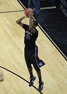 Scott Suggs is shooting the ball for the Washington Huskies