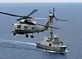 SH-60B from Helicopter Anti-submarine Squadron Light 47 banks over RSS Steadfast during flight deck qualifications with the Republic of Singapore Navy in April 2008.