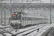 Push-pull set composed of two motor coaches (head and tail) and Revvivo coaches arriving in Rapperswil