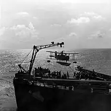 Scoutplane being hoisted on board USS Philadelphia