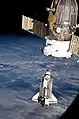 Discovery approaches the Space Station for docking.