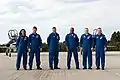 The crew poses for a photo at the KSC (including Bowen).