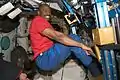 Mission Specialist Leland Melvin exercising inside the Unity module