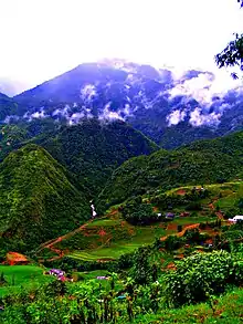 Photograph of the Sa Pa mountain hills with agricultural activity shiwn in the foreground