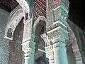 Details of the marble and stucco elements blending together in the corners of the chamber