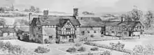 A black-and-white drawing showing a farm from a slightly elevated angle.  The farmhouse is to the left and has a protruding bay with a timber-framed gabled upper storey; a farm building is at a right-angle on the right, and its upper storey is entirely timber-framed.