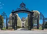 Salve Regina University's gates frame the building's driveway