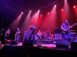 Samiam performing at the Fillmore Auditorium in 2022
Left to right: Kennerly, Darby, Beebout, Brooks (behind drum kit), and Loobkoff.