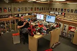 Geller sitting at his desk at the ShoeZeum