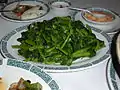 Sautéed snow pea shoots, a popular dish in Chinese cuisine