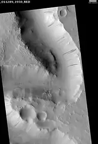 Scamander Vallis, as seen by HiRISE.  Click on image to see dark slope streaks in a variety of shades.  The darker the streak the younger it is. is an ancient river valley in the Amenthes quadrangle. Scale bar is 500 meters long.