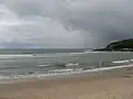 Looking down the beach towards the headland.