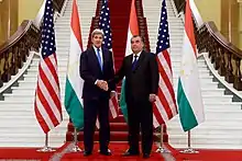 U.S. Secretary of State John Kerry shaking hands at the Palace in 2015