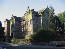 A stone house in three storeys with three gables