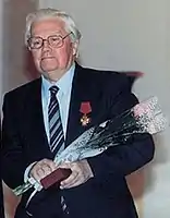 Serafim Tulikov after awarding the composer the  Order of Merit for the Fatherland, 1999