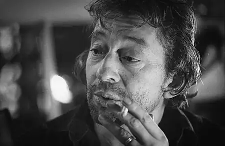 Image 8Serge GainsbourgPhotograph credit: Claude Truong-NgocSerge Gainsbourg (1928–1991) was a French musician, singer-songwriter, actor, author and filmmaker. Regarded as one of the most important figures in French pop music, he was renowned for often provocative and scandalous releases which caused uproar in France, dividing its public opinion, as well as his diverse artistic output, which ranged from his early work in jazz, chanson, and yé-yé to later efforts in rock, zouk, funk, reggae, and electronica. He is often regarded as one of the world's most influential popular musicians. His lyrical works incorporated wordplay, with humorous, bizarre, provocative, sexual, satirical or subversive overtones. Gainsbourg's music has reached legendary stature in France, and he has become one of the country's best-loved public figures. He has also gained a cult following all over the world with chart success in the United Kingdom and Belgium with "Je t'aime... moi non plus" and "Bonnie and Clyde", respectively. This photo of Gainsbourg was taken in 1981.More selected pictures