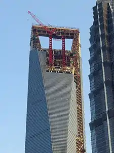 The aperture under construction at the top of the building.