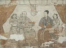 Chinese tomb occupants wearing Mongol-style clothing. The female tomb occupant is depicted wearing the woman's red Mongol robe under a short overjacket but does not wear the gugu hat, Shazishan Tomb Fresco, Yuan Dynasty.