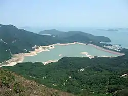 Shek Pik Reservoir, with Shek Pik Prison visible on the right.