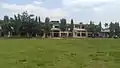 Distant shot of Shree Buddha Adarsha Uccha Madhyamik Vidyalaya, the oldest educational institution in the village