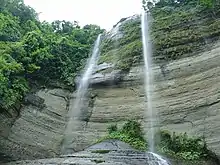 Image 61Shuvolong is a place in Barkol sub district, located about 25 kilometres (11 kilometres as the crow flies) away from Rangamati town. There are a few waterfalls in Shuvolong area with the largest one falling from as high as 300 feet. Shuvolong is accessible by speed boat or motor boats from Rangamati. The photo features Shovolong water falls in October (before winter).Photo Credit: Mirza Salman Hossain Beg, Bangladesh