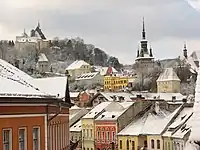 A winter view of the old town, including several spires