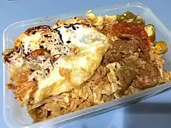 Beef fried rice topped with a sunny side up egg