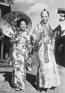 A still from the 1939 film Singing Lovebirds: Dick Mine (right) with co-star Tomiko Hattori.