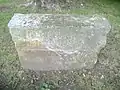 Stone outside Community Center, inscription reads "Gene Deardoff May 21, 1938"