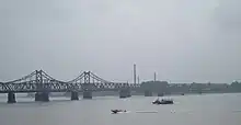 The Sino–Korean Friendship Bridge across the Yalu (Amnokgang) linking Sinuiju and Dandong.