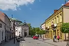 One of the streets of the town centre with historic townhouses and the Saint James church