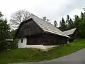 Traditional Pohorje wooden house in Skomarje