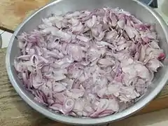 Sliced shallots ready for frying