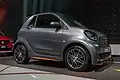 Front three quarter view of matte dark grey third generation Smart fortwo cabrio Brabus, IAA 2017 in Frankfurt.