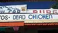 Sign along the roof advertising the "Dead Chicken" menu item