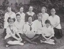 South San Francisco High School girls' basketball team, with coach Rue Randall Clifford at center of back row. From the school's 1917 yearbook, at Internet Archive.