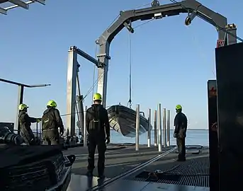 GO Navigator deploying a fast boat off the rear of the boat.