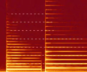 A spectrogram of a violin playing a note and then a perfect fifth above it. The shared partials are highlighted by the white dashes.