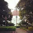 Exterior of the Blenduk Church, blanketed by the trees at Srigunting Garden.