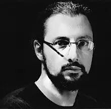 up-close, black-and-white image of Stéphane Ginsburgh staring intently at camera