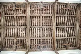 Carved wooden angels decorate the 15th-century tie-beam roof