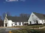 The Church and to the right, the building which contains the Chapel and Parish offices