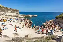 Beachgoers at St. Peter's Pool during summer