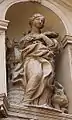 Sculpture of St. Barbara above the entrance to Santa Barbara dei Librari