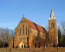 St Elisabeth's Church. The shadow across the roof is cast by the chimney from the nearby Reddish (Houldsworth) Mill.