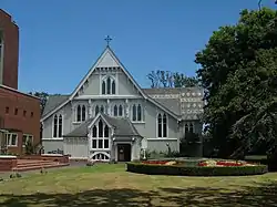 The modern cathedral complex includes Mountfort's earlier wooden cathedral of 1886. The terminating gables served as an inspiration to the façade of the cathedral nave