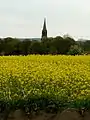 Spire in rural landscape