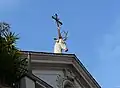 The stag-and-cross symbol of St. Eustace sits atop his church in Rome.